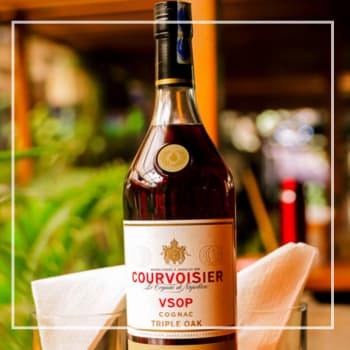 Premium cognac collection at Bamboo Cask Lounge in Ngara, Nairobi, featuring Hennessy, Martell, Rémy Martin, and other fine cognacs.